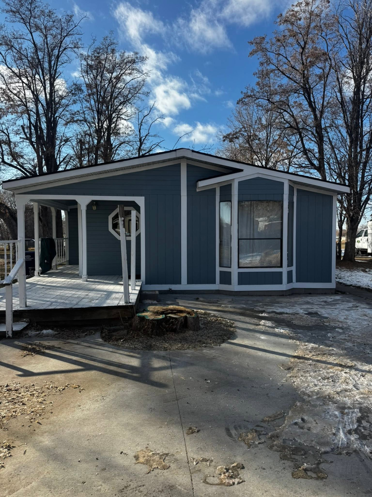 Freshly cleared work area beside customer home